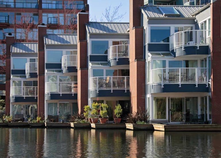 Modern waterfront apartments with balconies.